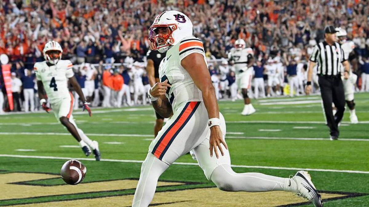  Auburn quarterback Ashton Daniels (12) flips the ball after scoring touchdown against Vanderbilt during the second at FirstBank Stadium in Nashville, Tenn., Saturday, Nov. 7, 2025. | USA TODAY Network via Reuters Connect 