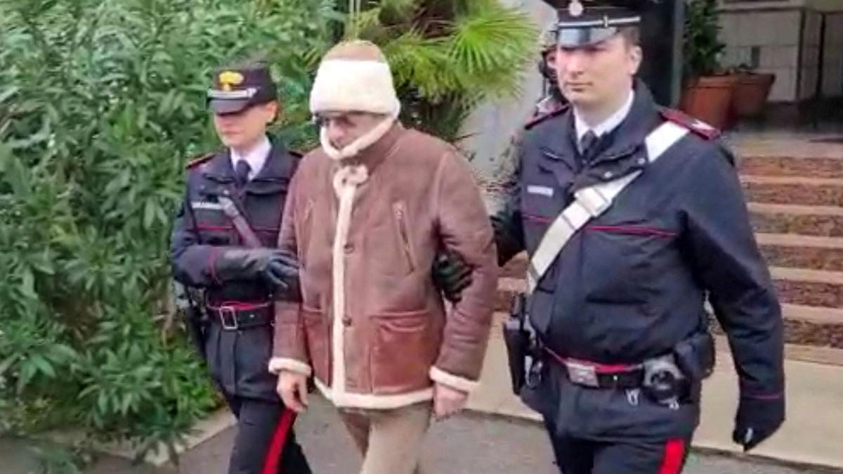 FILE PHOTO: A screengrab taken from a video shows Matteo Messina Denaro the country's most wanted mafia boss being escorted out of a Carabinieri police station after he was arrested in Palermo, Italy, January 16, 2023. Carabinieri/Handout via REUTERS/File Photo