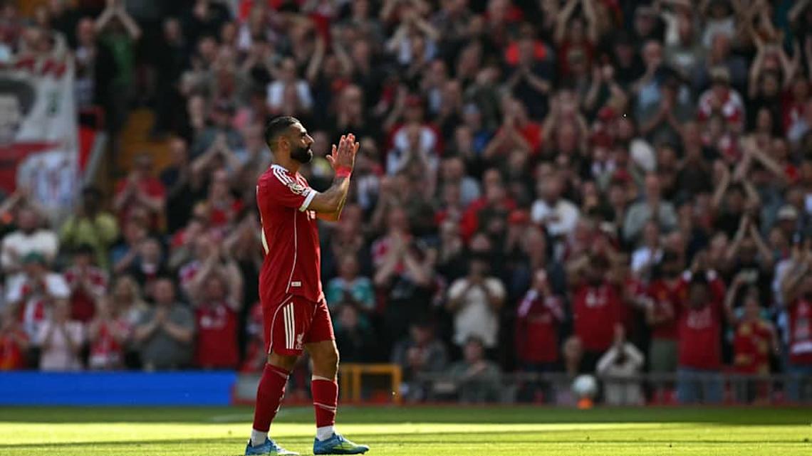  Salah applauded the fans as he left the pitch. | Paul ELLIS/AFP/Getty Images 