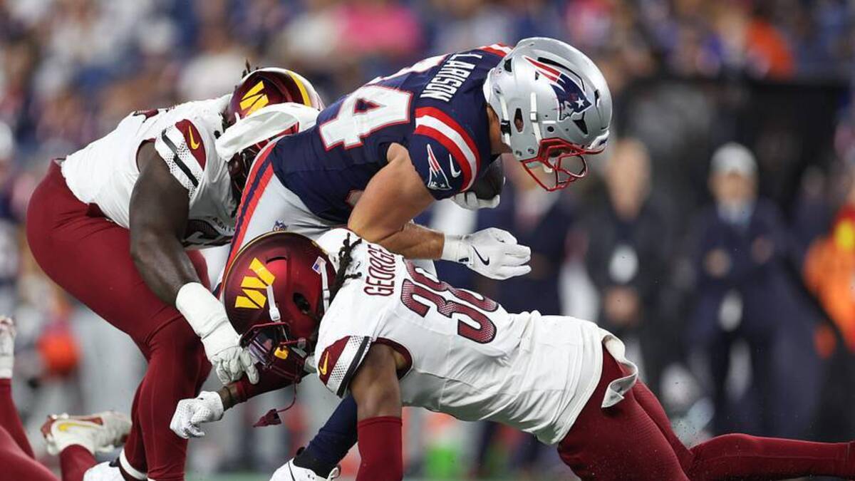  Aug 8, 2025; Foxborough, Massachusetts, USA; Washington Commanders cornerback Allan George (38) tackles New England Patriots running back Lan Larison (34) during the second half at Gillette Stadium. Mandatory Credit: Paul Rutherford-Imagn Images | Paul Rutherford-Imagn Images 