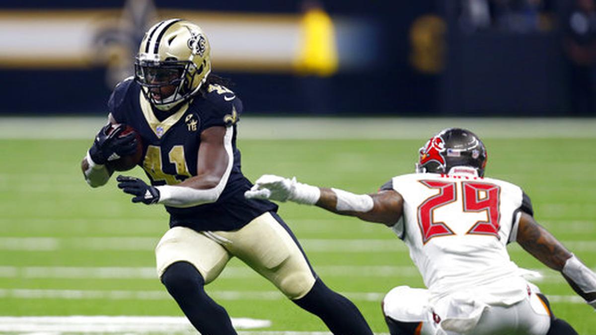 In this Sept. 9, 2018, file photo, New Orleans Saints running back Alvin Kamara (41) carries against Tampa Bay Buccaneers cornerback Ryan Smith (29) during the first half of an NFL football game in New Orleans. The Saints’ surge to the NFC South title last season was fueled to a large degree by a rejuvenated running game that ranked fifth in the NFL. The addition of Kamara, who became the 2017 NFL Offensive Rookie of the Year, to Mark Ingram, who had his second consecutive 1,000-yard rushing season, gave New Orleans an elite tandem. Heading into Sunday’s game against Atlanta, the Saints are averaging an NFL-worst 52.5 yards rushing during a 1-1 start.