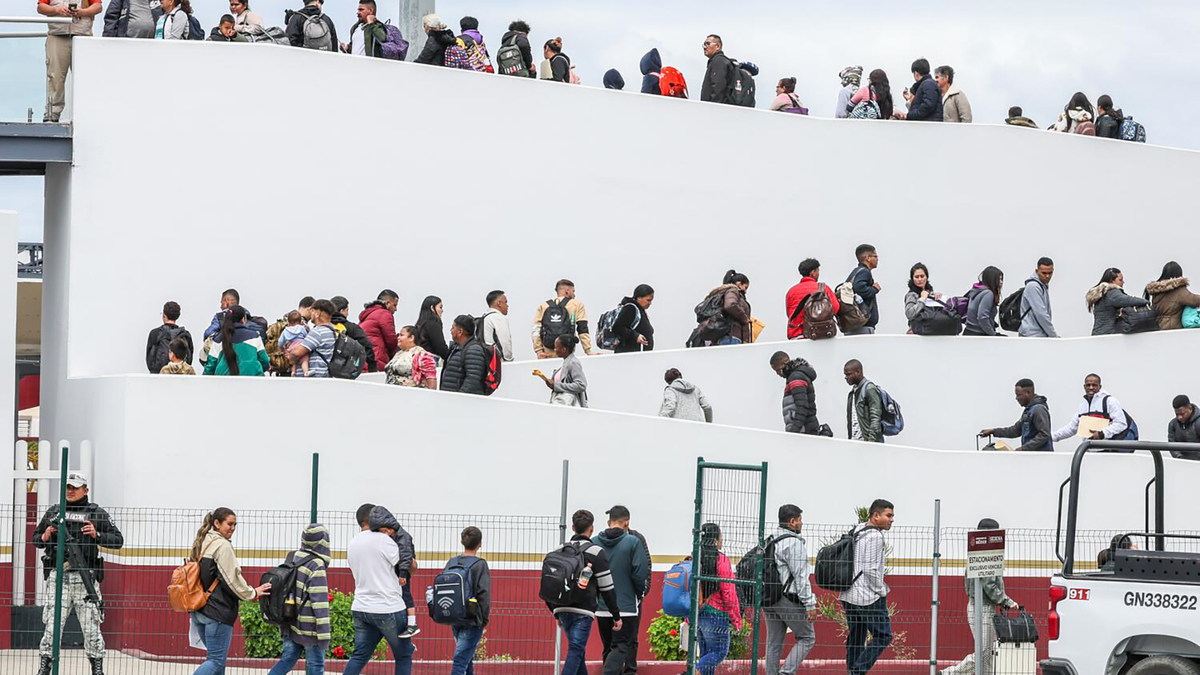 Hundreds of asylum seekers who used a CBP phone app to make an appointment, are led to their interviews with U.S. customs agents at the San Ysidro Border Crossing on April 25, 2024, in Tijuana, Mexico. (Robert Gauthier/Los Angeles Times/TNS)