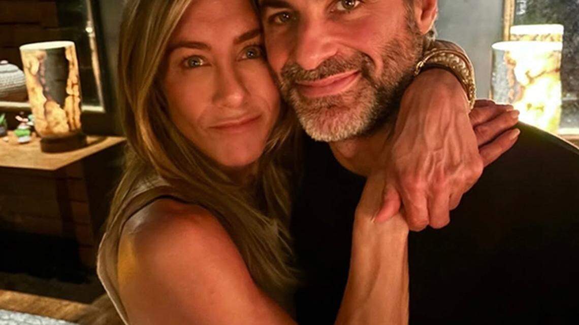 Jennifer Aniston cuddles up with boyfriend Jim Curtis in new photos