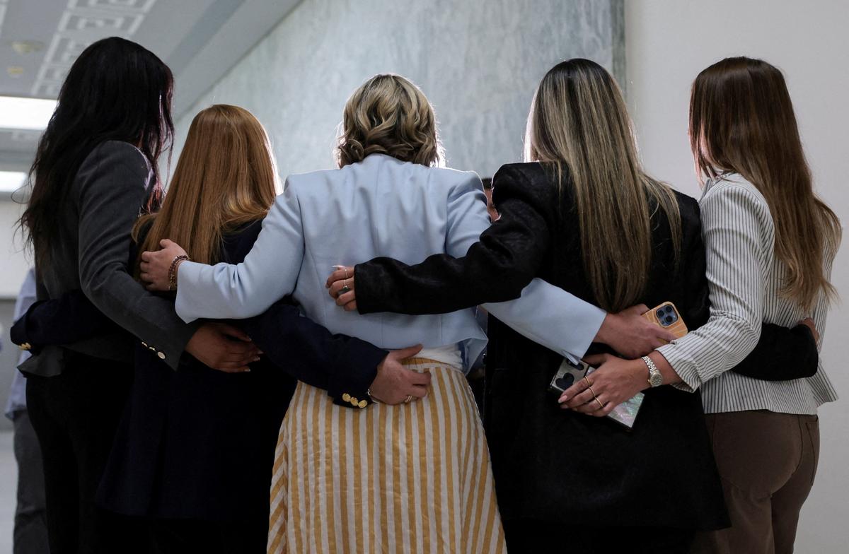 Survivors of Jeffrey Epstein pose for a picture outside a House Oversight and Government Reform Committee interview with former U.S. Attorney General Pam Bondi as part of the committee's ongoing probe into the Justice Department's handling of the Epstein files, on Capitol Hill in Washington, D.C., U.S., May 29, 2026. REUTERS/Jonathan Ernst