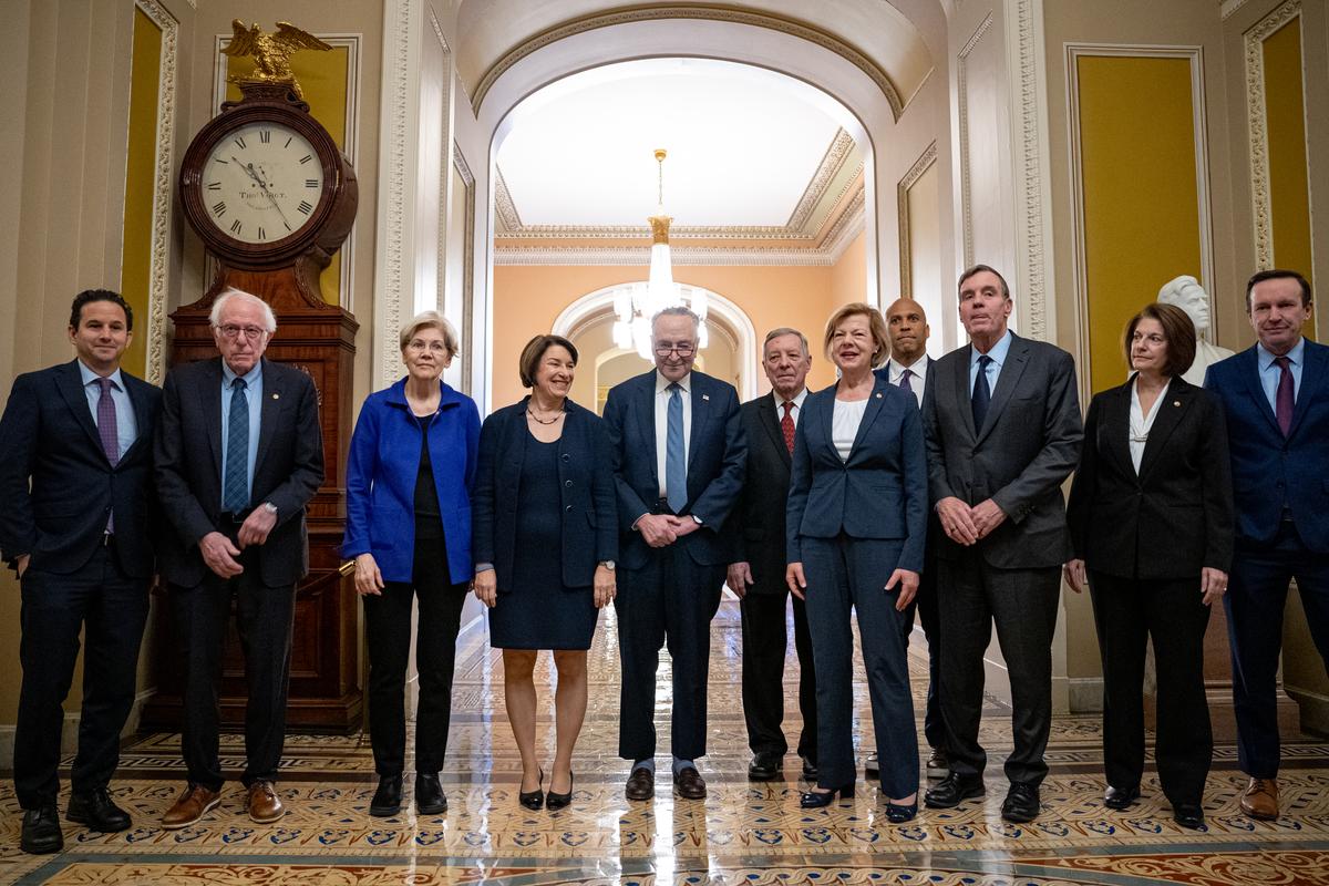  From left: Senators Brian Schatz of Hawaii; Bernie Sanders, a Vermont independent, Elizabeth Warren of Massachusetts; Amy Klobuchar of Minnesota; Then-Senate Majority Leader Chuck Schumer of New York; Then-Senate Majority Whip Richard Durbin of Illinois; Tammy Baldwin of Wisconsin; Cory Booker of New Jersey; Mark Warner of Virginia; Catherine Cortez Masto of Nevada; and Chris Murphy of Connecticut are seen in the U.S. Capitol on December 3, 2024, in Washington, DC. (Photo by Andrew Harnik/Getty Images) 