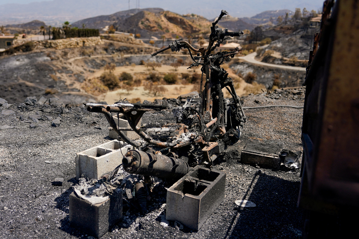 A view of a burnt motorbike at the aftermath of deadly wildfires in Bedar, Almeria, Spain July 13, 2026. REUTERS/Ana Beltran