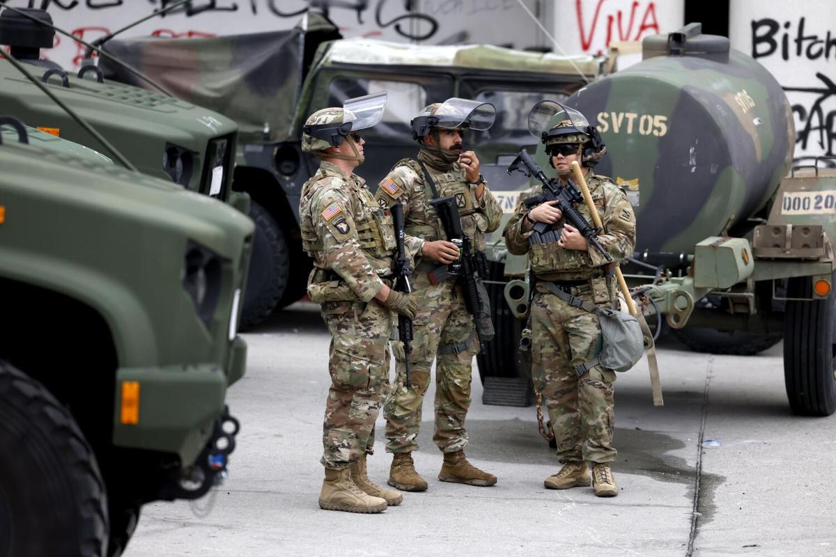 Members of the National Guard are stationed at the Metropolitan Detention Center in Los Angeles on Sunday, June 8, 2025.
