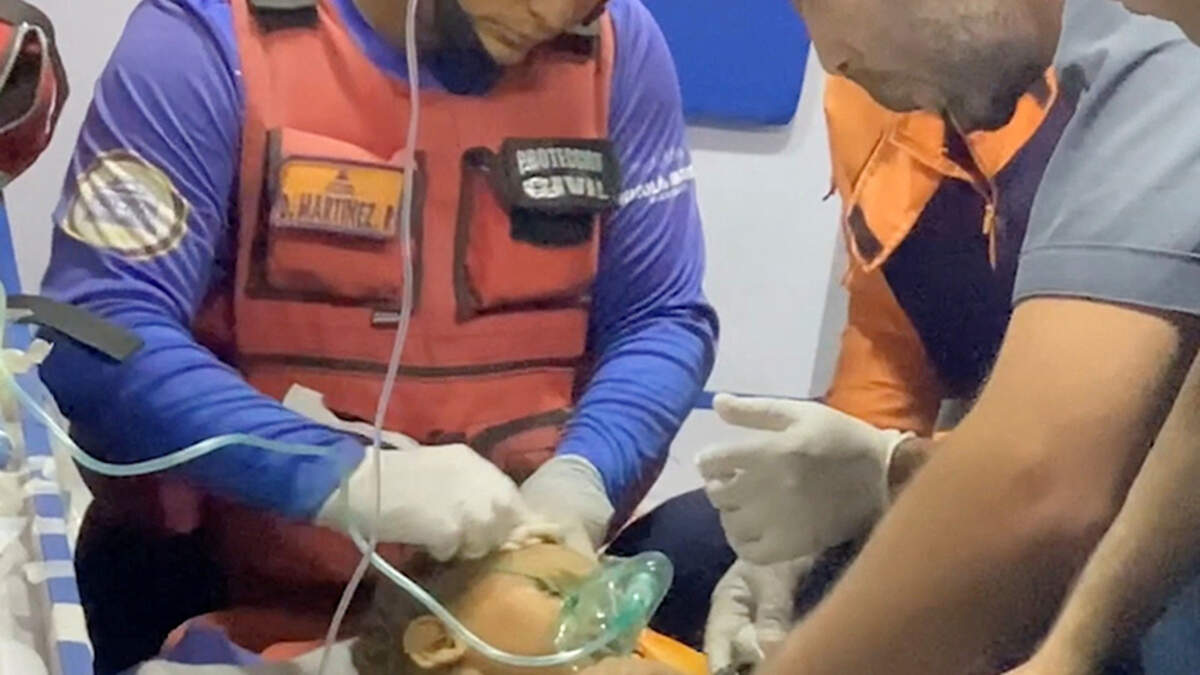 A child receives emergency medical attention after being rescued from under rubble by a Jordanian team following last week’s dual earthquakes in Venezuela, in a location given as Caracas, in this still image obtained from a handout video released on Tuesday.