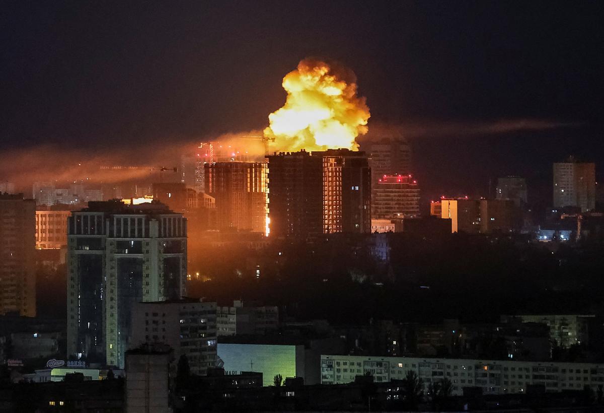 An explosion lights up the sky over the city during a Russian missile and drone strike, amid Russia's attack on Ukraine, in Kyiv, Ukraine June 2, 2026. REUTERS/Gleb Garanich