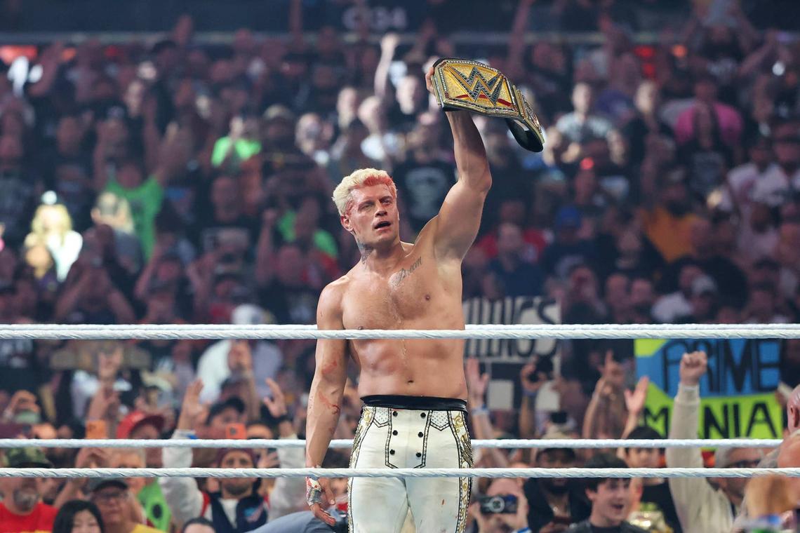 Cody Rhodes raises the WWE Championship in front of a packed crowd during WrestleMania 42 Night One.Getty Images