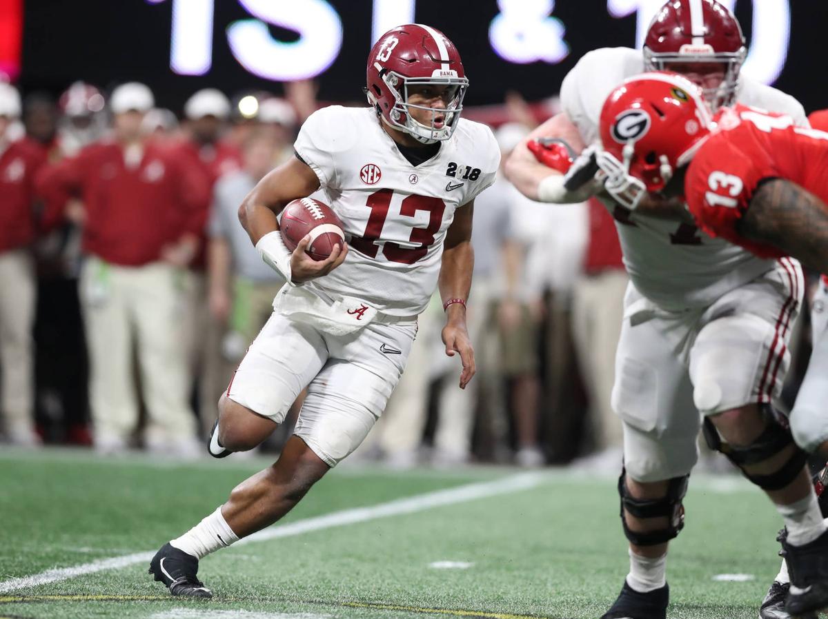  Alabama Crimson Tide quarterback Tua Tagovailoa runs with the ball against the Georgia Bulldogs in the 2018 CFP national championship game at Mercedes-Benz Stadium. Matthew Emmons-USA TODAY Sports