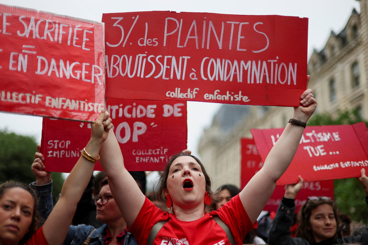 People attend a demonstration, amid nationwide calls to protest the handling by the criminal justice system of previous complaints involving child victims against the main suspect in the killing of 11-year-old Lyhanna, whose body was discovered near Fleurance after a days-long search, near the  Paris courthouse, France, June 8, 2026, in a protest supported by the #NousToutes movement. The sign reads: "Only 3% of complaints lead to conviction". REUTERS/Gonzalo Fuentes
