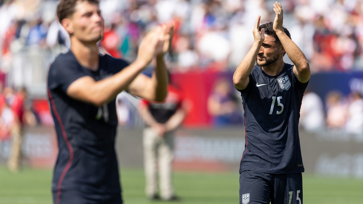 United States midfielders Sebastian Berhalter, left, and Cristian Roldan (15) thank the crowd after a friendly against Germany at Soldier Field on Saturday, June 6, 2026, in Chicago. (Josh Boland/Chicago Tribune/TNS)