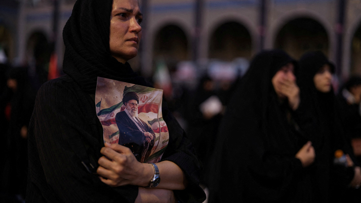 A mourner holds a portrait of late Supreme Leader Ayatollah Ali Khamenei, who was killed on February 28 in Israeli and U.S. airstrikes,  during a public farewell ceremony to pay their respects, at the Imam Khomeini Grand Mosalla, in Tehran, Iran July 4, 2026. REUTERS/Mohammed Salem Foreign media in Iran operate under guidelines set by the Ministry of Culture and Islamic Guidance, which regulates press activity and permissions