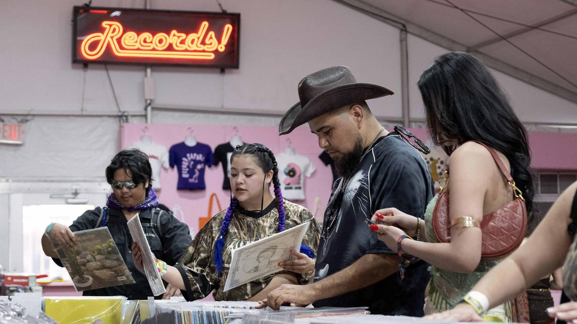 Arturo Cecena, second from right, shops for vinyl records inside Record Safari during day two of the Coachella Valley Music & Arts Festival in Indio on Saturday, April 18, 2026. (Photo by Drew A. Kelley, Press-Telegram/SCNG)