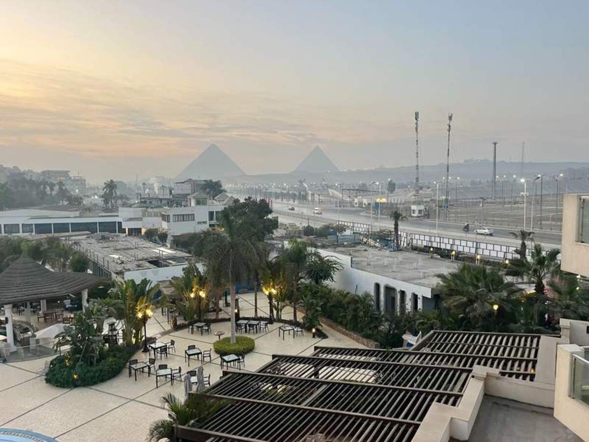  A front-row view of the Pyramids of Giza emerging from the dawn mist, taken from my balcony at the Steigenberger Pyramids Hotel. Photo credit: Lauren Salisbury 