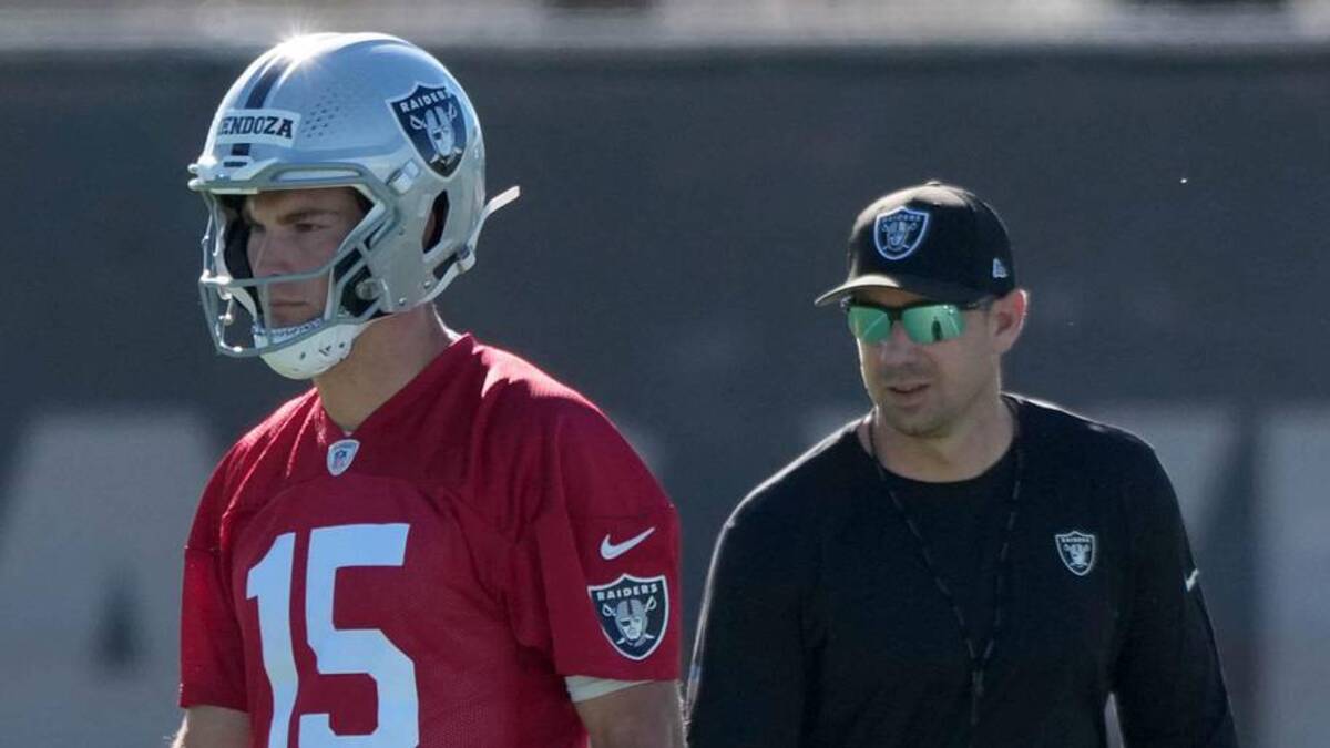  Jun 9, 2026; Henderson, NV, USA; Las Vegas Raiders quarterback Fernando Mendoza (15) and coach Klint Kubiak during minicamp at Intermountain Health Performance Center. Mandatory Credit: Kirby Lee-Imagn Images | Kirby Lee-Imagn Images 