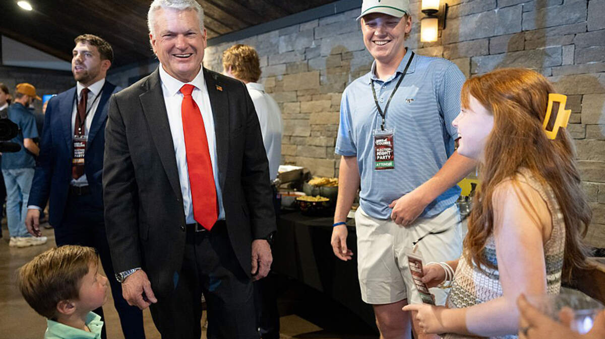 U.S. Rep. Mike Collins (R-Ga.), a Republican candidate for U.S. Senate, greets supporters during his election night party in Jackson, Georgia, on Tuesday. Collins, who had the endorsement of President Donald Trump, defeated former football coach Derek Dooley in the runoff and will face incumbent Democratic U.S. Sen. Jon Ossoff.