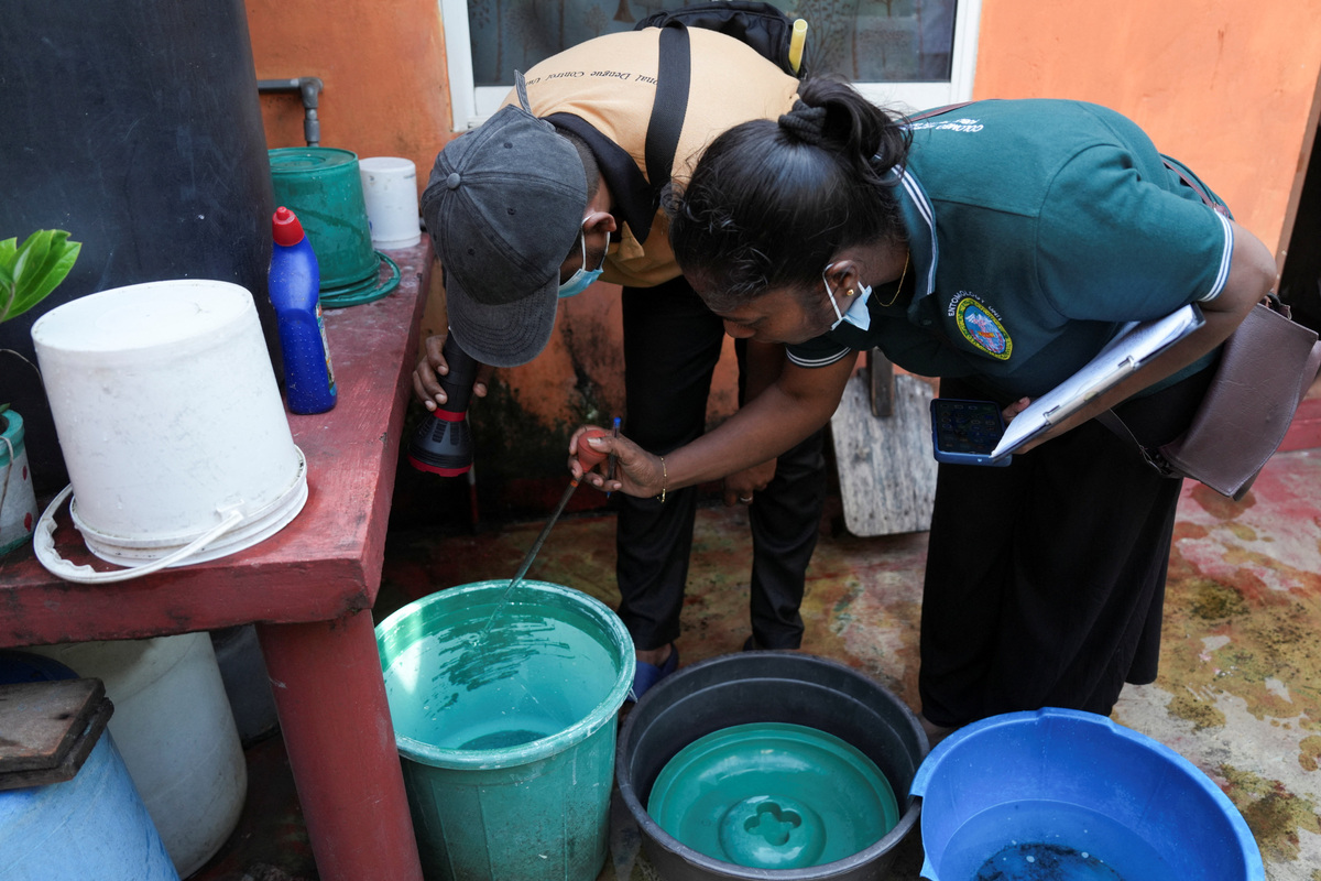 Workers from the Medical Officer of Health (MOH) department inspect and collect evidences at a house during a dengue prevention programme in Colombo, Sri Lanka, June 19, 2026. REUTERS/Thilina Kaluthotage