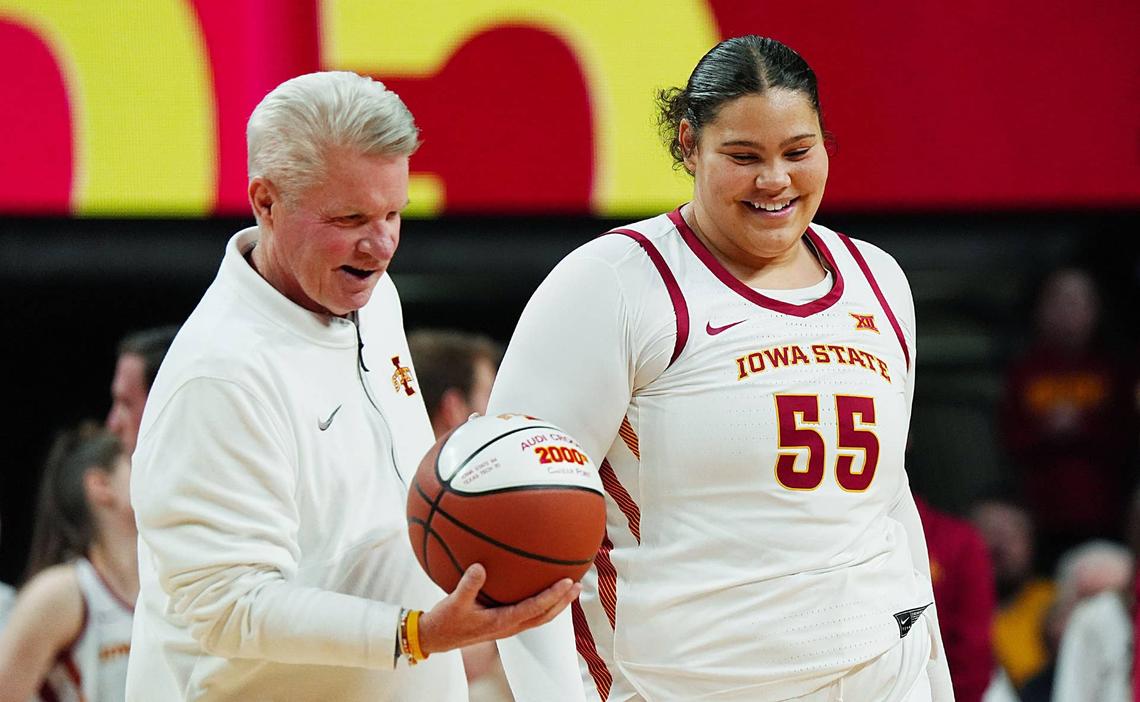  Iowa State Cyclones' center Audi Crooks (55) receives the ball from head coach Bill Fennelly in honor her 2000- career point before Iowa State and UFC women's basketball on Jan. 31, 2026, at Hilton Coliseum in Ames, Iowa. 