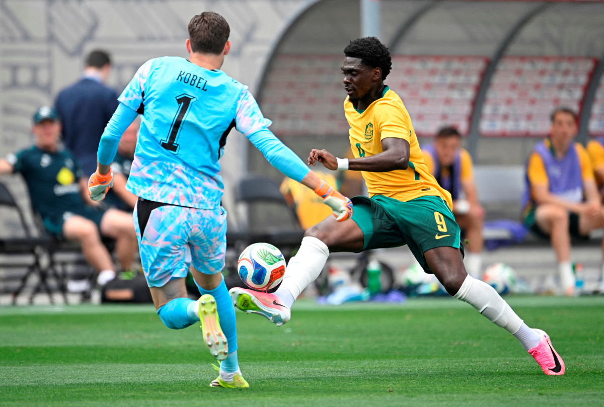 FILE PHOTO: Soccer Football - International Friendly - Switzerland v Australia - Snapdragon Stadium, San Diego, California, U.S. - June 6, 2026 Australia's Mohamed Toure in action with Switzerland's Gregor Kobel IMAGN IMAGES via Reuters/Denis Poroy/File Photo