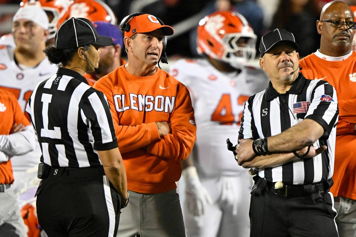  Nov 14, 2025; Louisville, Kentucky, USA; Clemson Tigers head coach Dabo Swinney talks with the officials during the first half against the Louisville Cardinals at L&N Federal Credit Union Stadium. Mandatory Credit: Jamie Rhodes-Imagn Images 