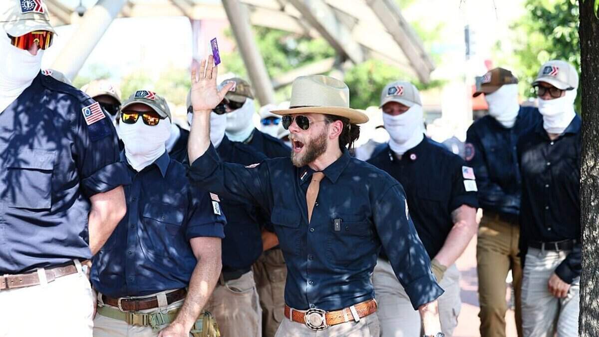 Founder of the white supremacist group Patriot Front Thomas Rousseau, center, and fellow members gather at Eastern Market metro station on July 4, 2026, in Washington, DC. Their march through neighborhoods around the U.S. Capitol was brief, according to the Metropolitan Police Department.
