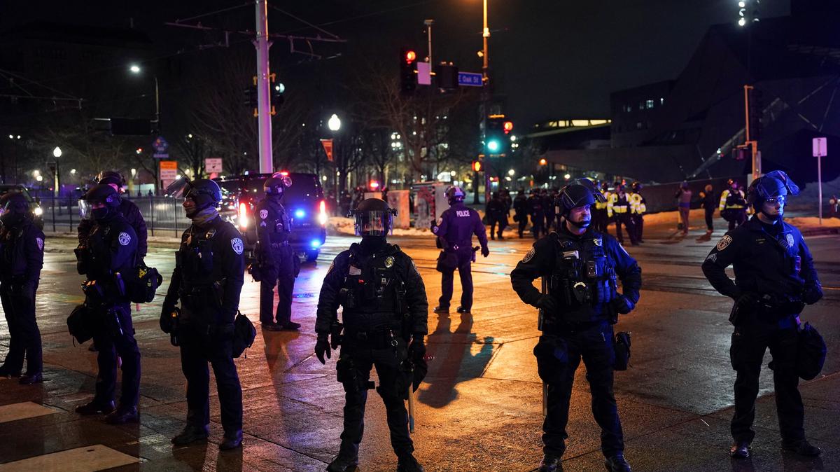 Police officers stand guard after declaring unlawful assembly, as demonstrators gathered outside a hotel they believe is being used by federal agents, amid increased immigration enforcement in Minneapolis, Minnesota, U.S., February 5, 2026. REUTERS/Seth Herald