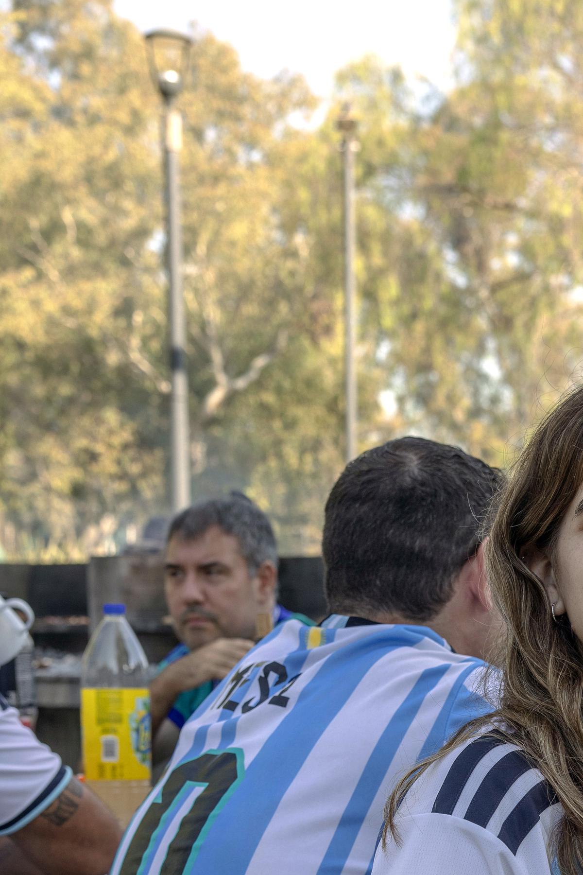 Soledad Aldao, a 35-year-old Argentina supporter, at a barbecue organized by fellow fans in Buenos Aires on April 12, 2026. Dynamic ticket pricing has made this year's World Cup tournament the most expensive in history, pushing Argentine fans to extremes. (Sarah Pabst/The New York Times)
