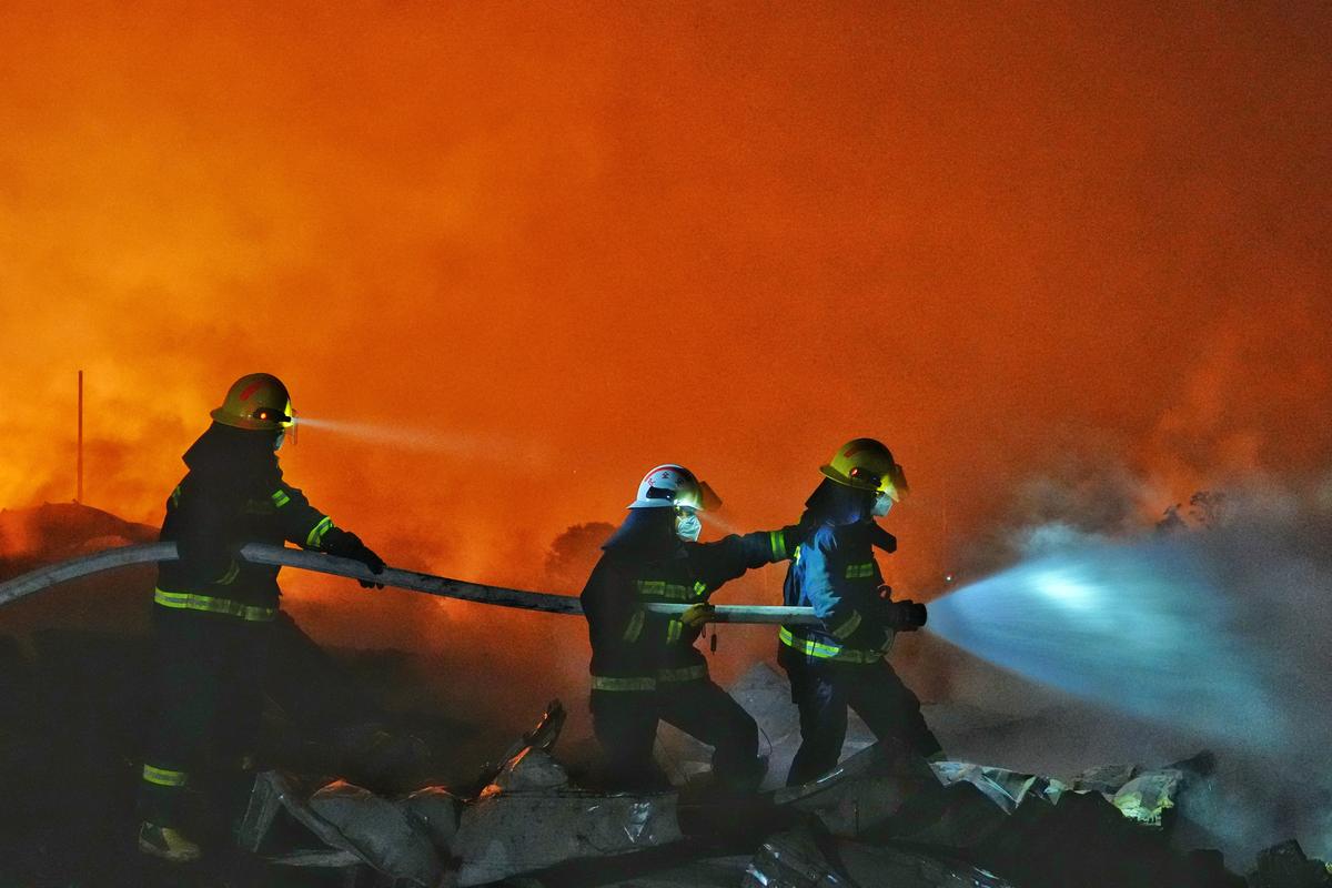 Firefighters work to distinguish a fire following a blast at a fireworks manufacturing factory in Liuyang, Hunan province, China, May 5, 2026. cnsphoto via REUTERS