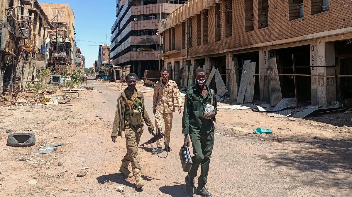 Fighters loyal to the army patrol a market area in Khartoum on March 24, 2025. For nearly two years, Sudan has been ravaged by a war between the regular army and the RSF, a conflict that has killed tens of thousands of people, uprooted over 12 million more and created the world's largest hunger and displacement crises. (-/AFP via Getty Images/TNS)