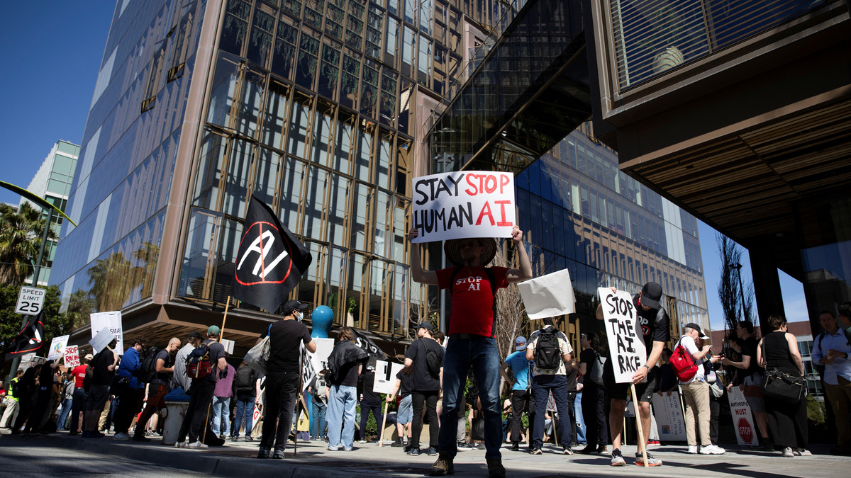FILE PHOTO: Protesters rally outside of the OpenAI headquarters before marching to the office of xAI, calling for a pause in AI development, in San Francisco, California, U.S., March 21, 2026. REUTERS/Manuel Orbegozo/File Photo