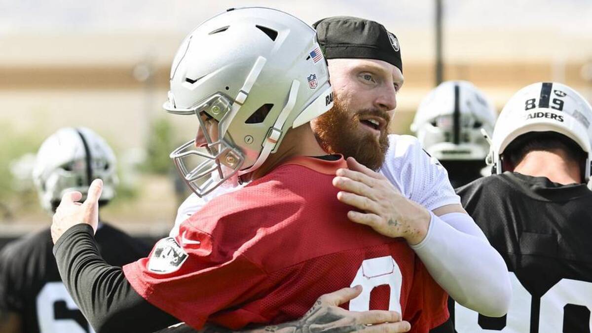  Jun 3, 2026; Henderson, NV, USA; Las Vegas Raiders defensive end Maxx Crosby (98) hugs quarterback Kirk Cousins (8) during organized team activities at Intermountain Health Performance Center. Mandatory Credit: Candice Ward-Imagn Images | Candice Ward-Imagn Images 