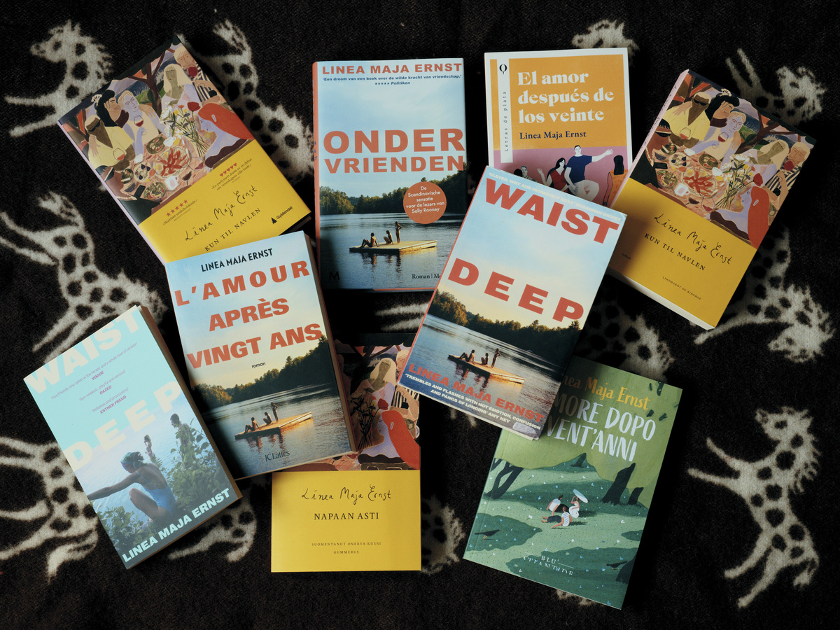 Translated copies in various languages of the novel "Waist Deep" by Danish author Linea Maja Ernst in Copenhagen, Denmark, June 1, 2026. Since its release in Danish in 2024, "Waist Deep" has been published in 10 languages. (Mathias Eis/The New York Times)