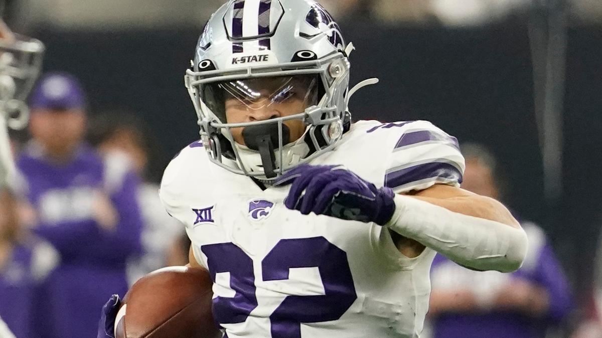 Kansas State running back Deuce Vaughn carries the ball in the first half of the Big 12 championship game against TCU on Dec. 3, 2022, in Arlington, Texas.