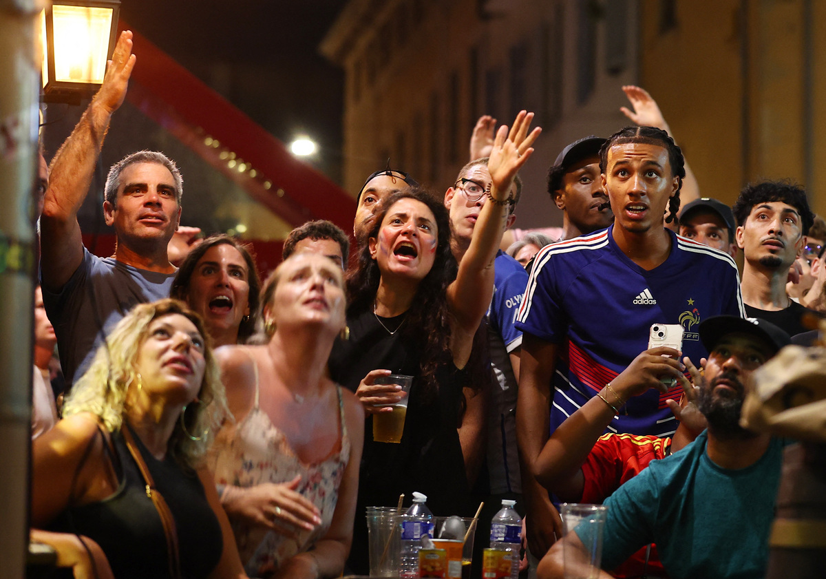 Soccer Football - FIFA World Cup 2026 - Semi Final - France v Spain - Fans gather in Marseille - Marseille, France - July 14, 2026 France fans react during the match in the Old Port of Marseille REUTERS/Manon Cruz