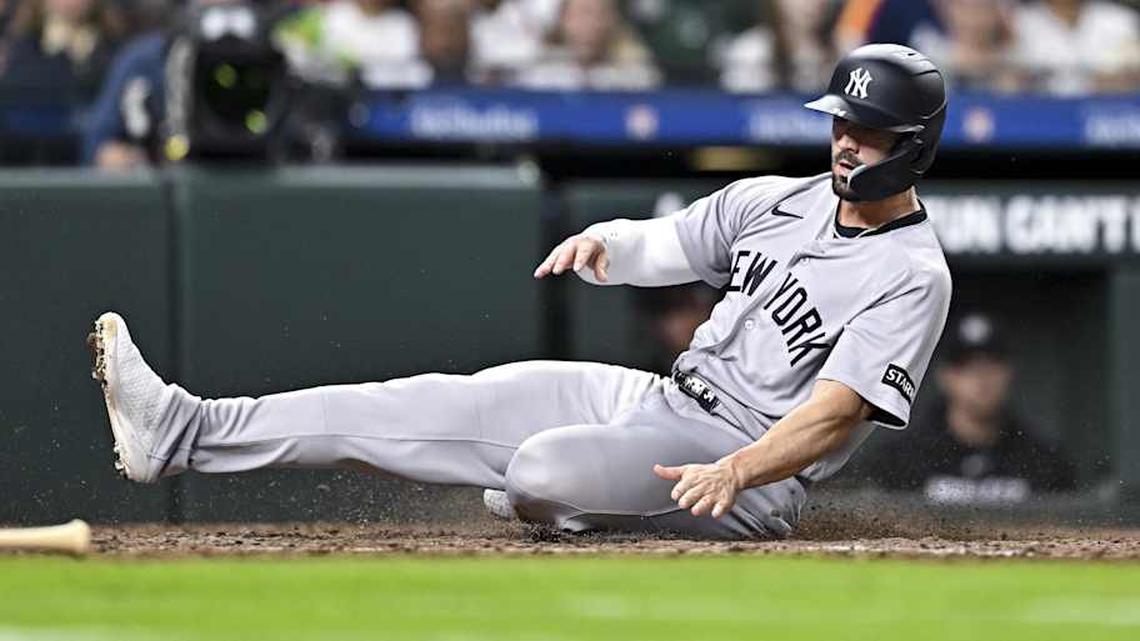  New York Yankees right fielder Randal Grichuk (34) sliding safely into home in the seventh inning against the Houston Astros at Daikin Park. | Maria Lysaker-Imagn Images 