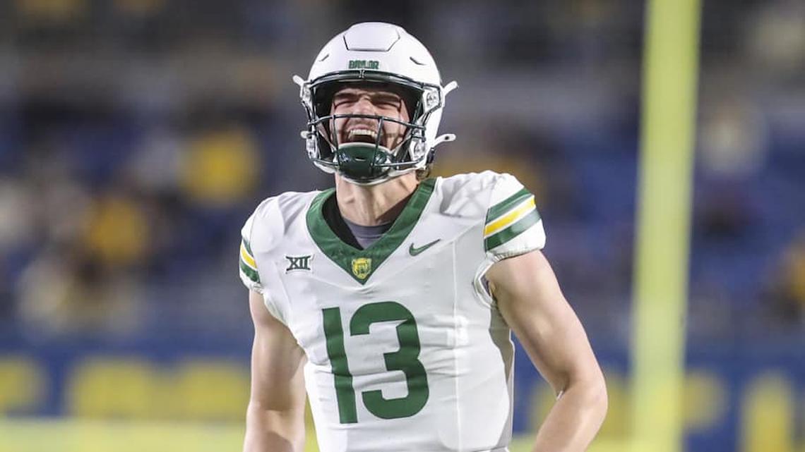  Nov 16, 2024; Morgantown, West Virginia, USA; Baylor Bears quarterback Sawyer Robertson (13) celebrates after a touchdown during the second quarter against the West Virginia Mountaineers at Mountaineer Field at Milan Puskar Stadium. Mandatory Credit: Ben Queen-Imagn Images | Ben Queen-Imagn Images 