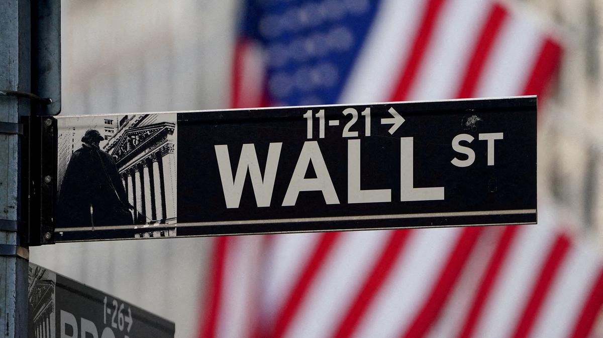 FILE PHOTO: The Wall Street sign is pictured at the New York Stock Exchange in the Manhattan borough of New York City, New York, U.S., March 9, 2020. REUTERS/Carlo Allegri//File Photo