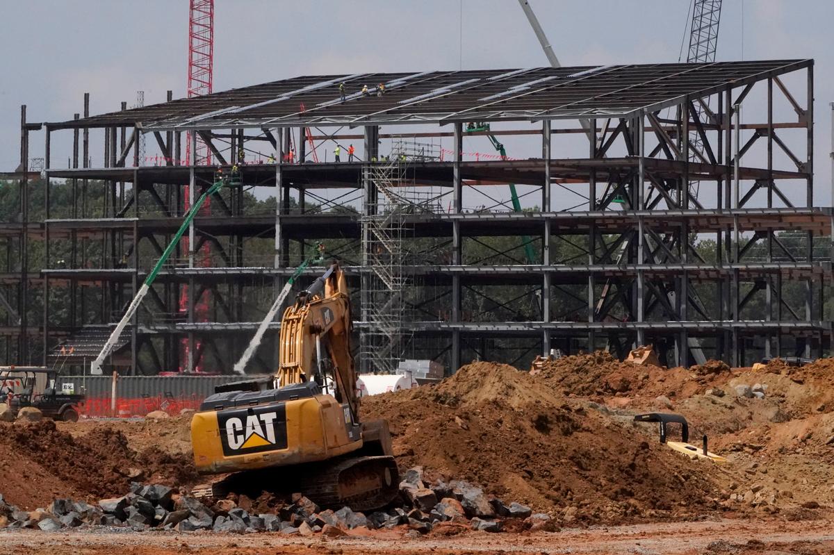 FILE -Construction personnel work on Carolina Panthers’ state-of-the-art team headquarters and practice facility Tuesday, Aug. 24, 2021, in Rock Hill, S.C. Carolina Panthers owner David Tepper’s real estate company announced Tuesday, April 19, 2022, they’ve terminated their agreement with the City of Rock Hill, leaving the future of the NFL team’s planned $800 million headquarters and practice facility up in the air. (AP Photo/Chris Carlson, File)