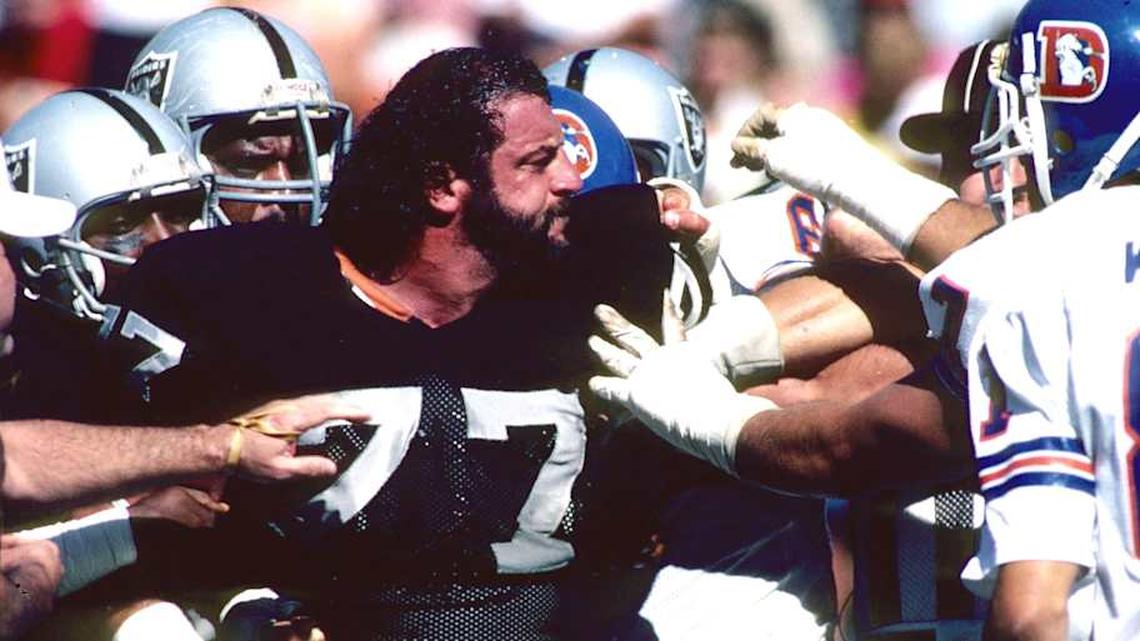  Sep 25, 1983; Denver, CO, USA; FILE PHOTO; Los Angeles Raiders defensive tackle Lyle Alzado (77) gets in an altercation with the Denver Broncos at Mile High Stadium. The Raiders defeated the Broncos 22-7. Mandatory Credit: Malcolm Emmons-Imagn Images | Malcolm Emmons-Imagn Images 