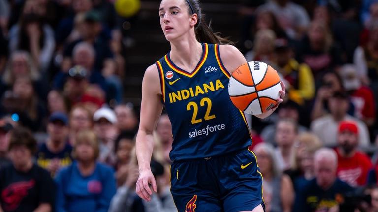 Fever guard Caitlin Clark (back) sits out vs. Fire 