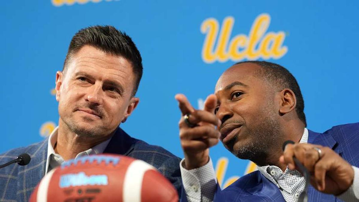 Dec 9, 2025; Los Angeles, CA, USA; UCLA Bruins football coach Bob Chesney (left) and athletic director Martin Jarmond at introductory press conference at Renee Luskin Conference Center Centennial Ballroom. Mandatory Credit: Kirby Lee-Imagn Images | Kirby Lee-Imagn Images 