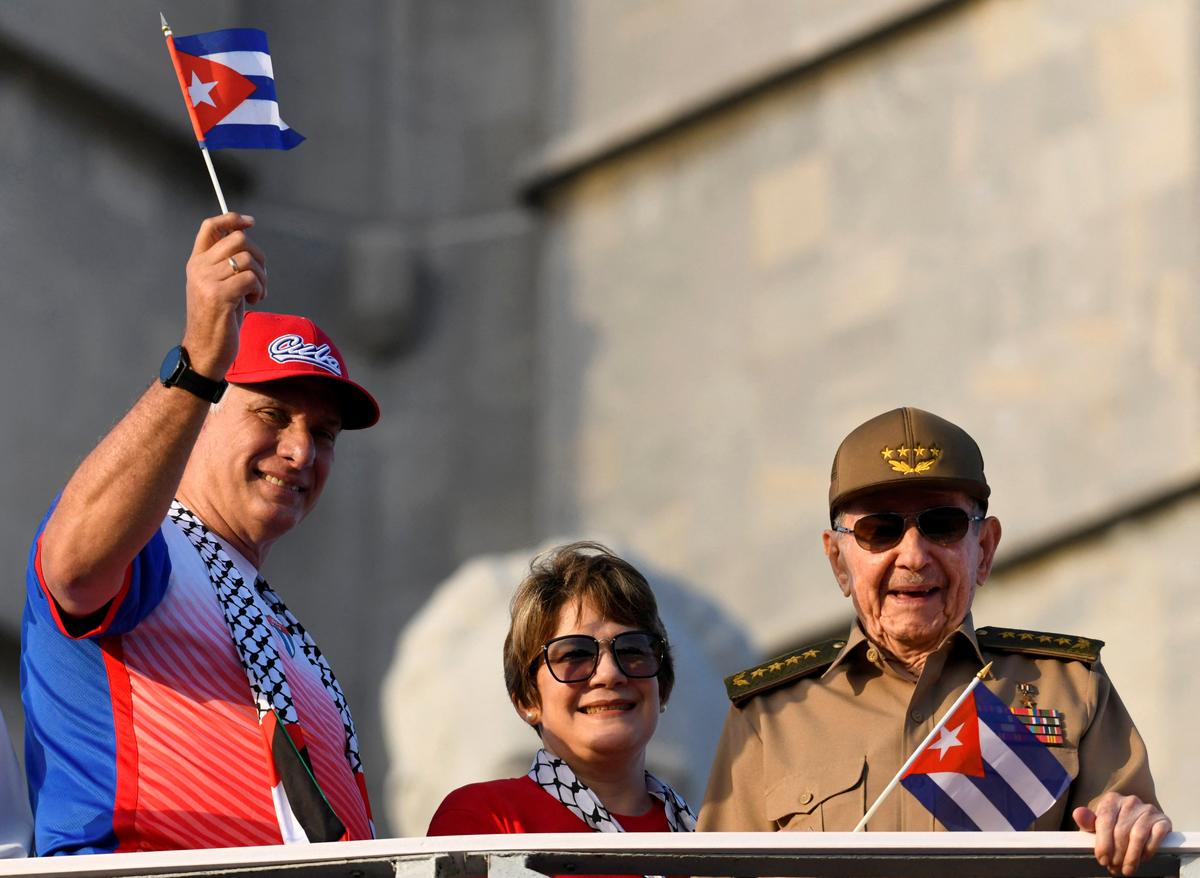 Cuba's former President Raul Castro, Cuba's President and First Secretary of the Communist Party Miguel Diaz-Canel and his wife Lis Cuesta Peraza watch a May Day rally in Havana, Cuba May 1, 2025. REUTERS/Norlys Perez