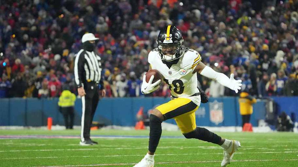  Jan 15, 2024; Orchard Park, New York, USA; Pittsburgh Steelers wide receiver Diontae Johnson (18) runs the ball in the second half against the Buffalo Bills in a 2024 AFC wild card game at Highmark Stadium. Mandatory Credit: Kirby Lee-Imagn Images | Kirby Leei-Imagn Images 