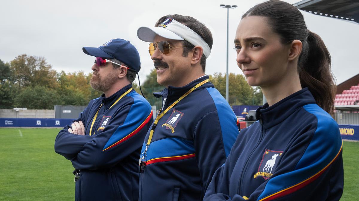 From left, Brendan Hunt, Jason Sudeikis and Tanya Reynolds in “Ted Lasso” Season 4, premiering Aug. 5 on Apple TV. (Colin Hutton/Apple TV/TNS)