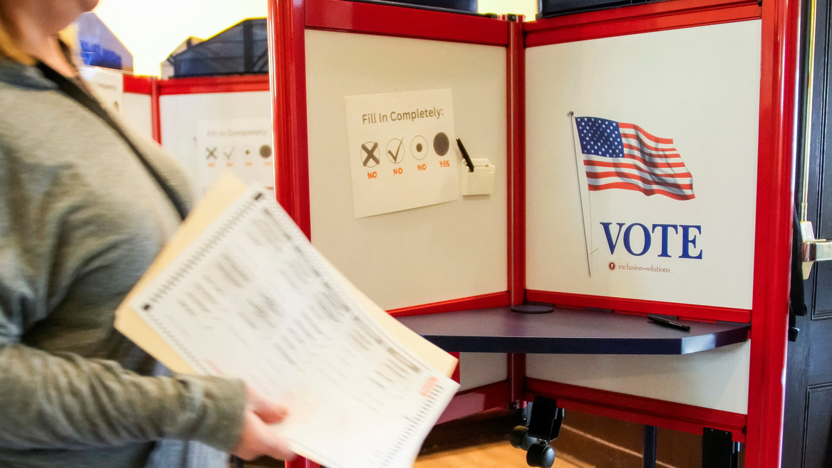 A person walks with her ballot to vote during the New Jersey primary elections for U.S. Congress, in Glen Ridge, New Jersey, U.S., June 2, 2026. REUTERS/Eduardo Munoz
