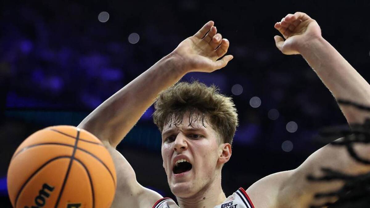  Mar 22, 2026; Philadelphia, PA, USA; UConn Huskies center Eric Reibe (12) dunks the ball against the UCLA Bruins in the first half during a second round game of the men's 2026 NCAA Tournament at Xfinity Mobile Arena. Mandatory Credit: Bill Streicher-Imagn Images | Bill Streicher-Imagn Images 