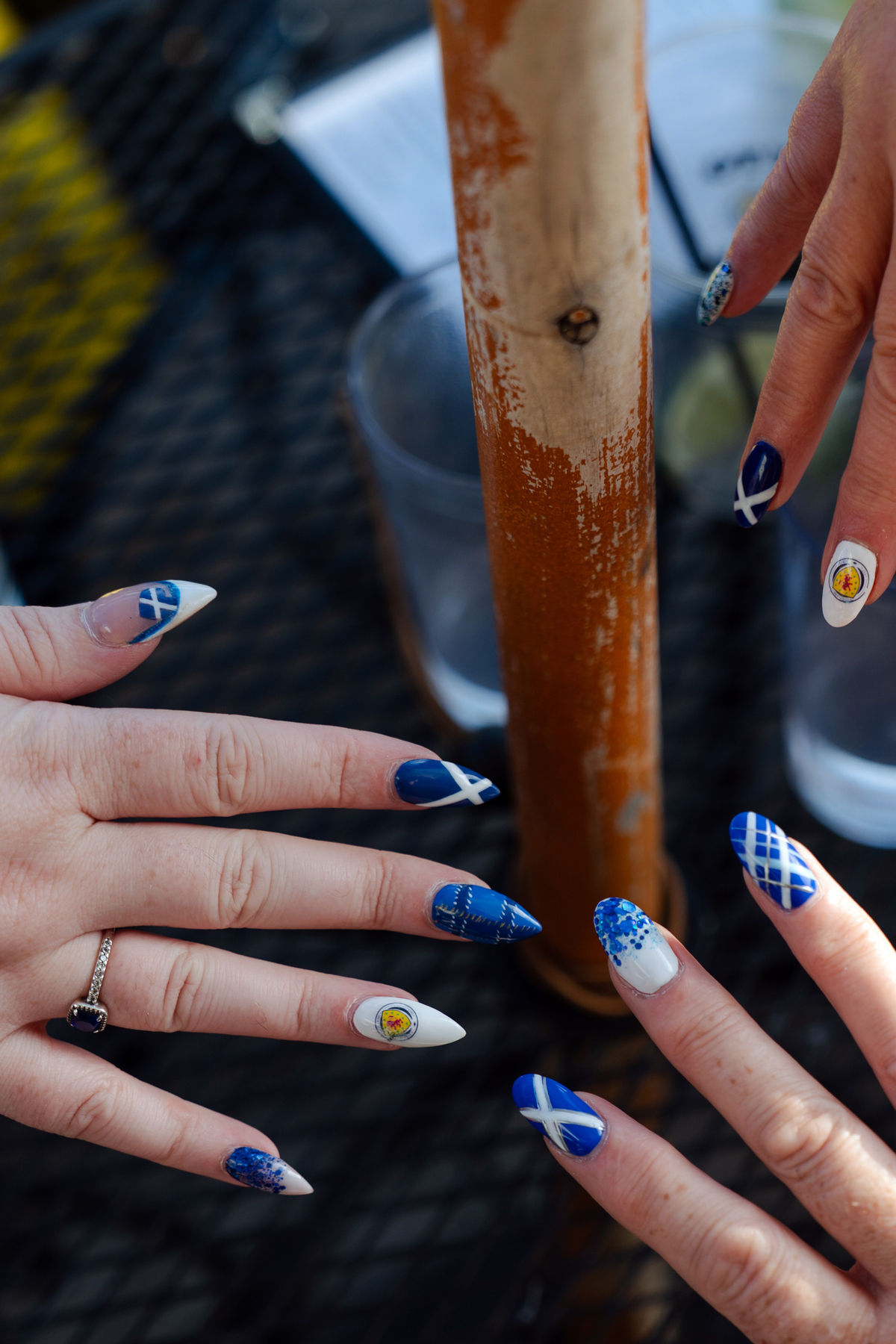 Scotland soccer fans show off their nails while watching the Iraq vs. Norway World Cup game at The Haven, a Scottish bar in Boston's Jamaica Plain neighborhood, on June 16, 2026. (Sophie Park/The New York Times)