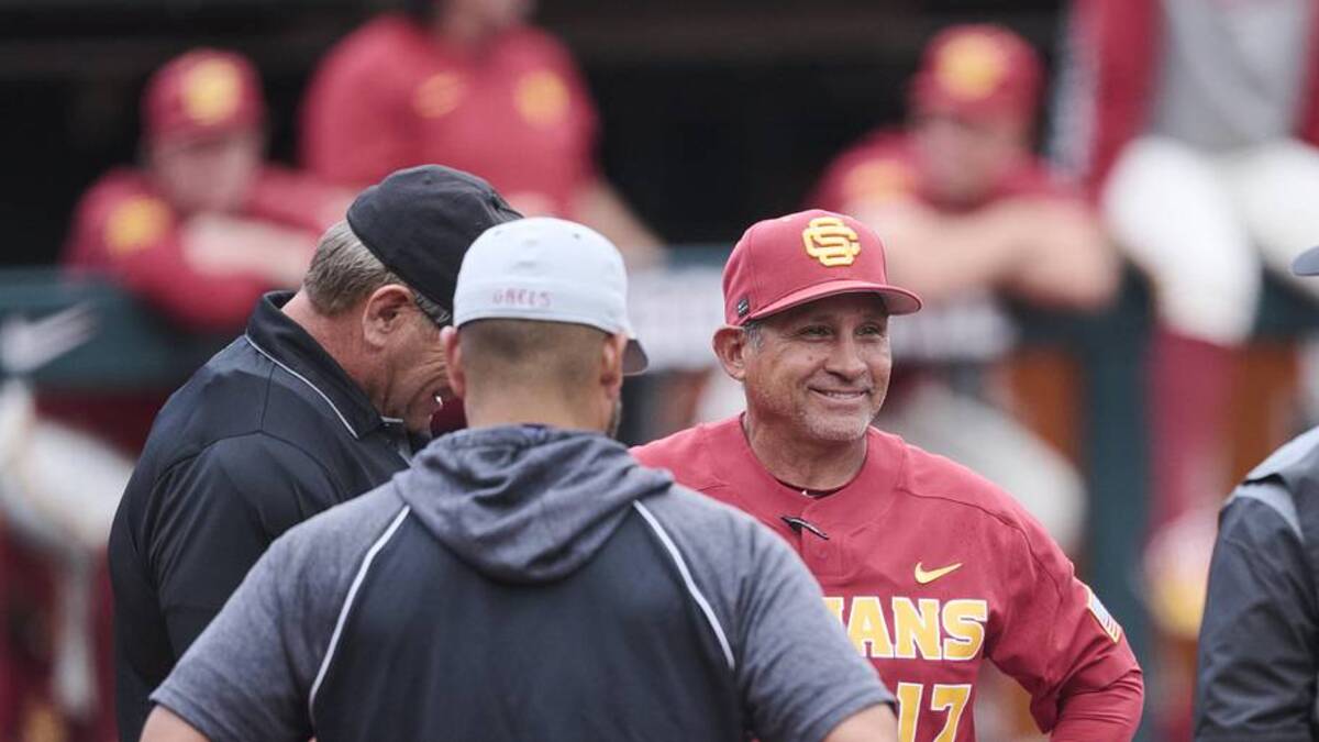  May 31, 2025; Corvallis, OR, USA; USC head coach Andy Stankiewicz visits with official before a game against Saint Mary's at the NCAA Corvallis Regional at Goss Stadium. Mandatory Credit: Troy Wayrynen-Imagn Images | Troy Wayrynen-Imagn Images 